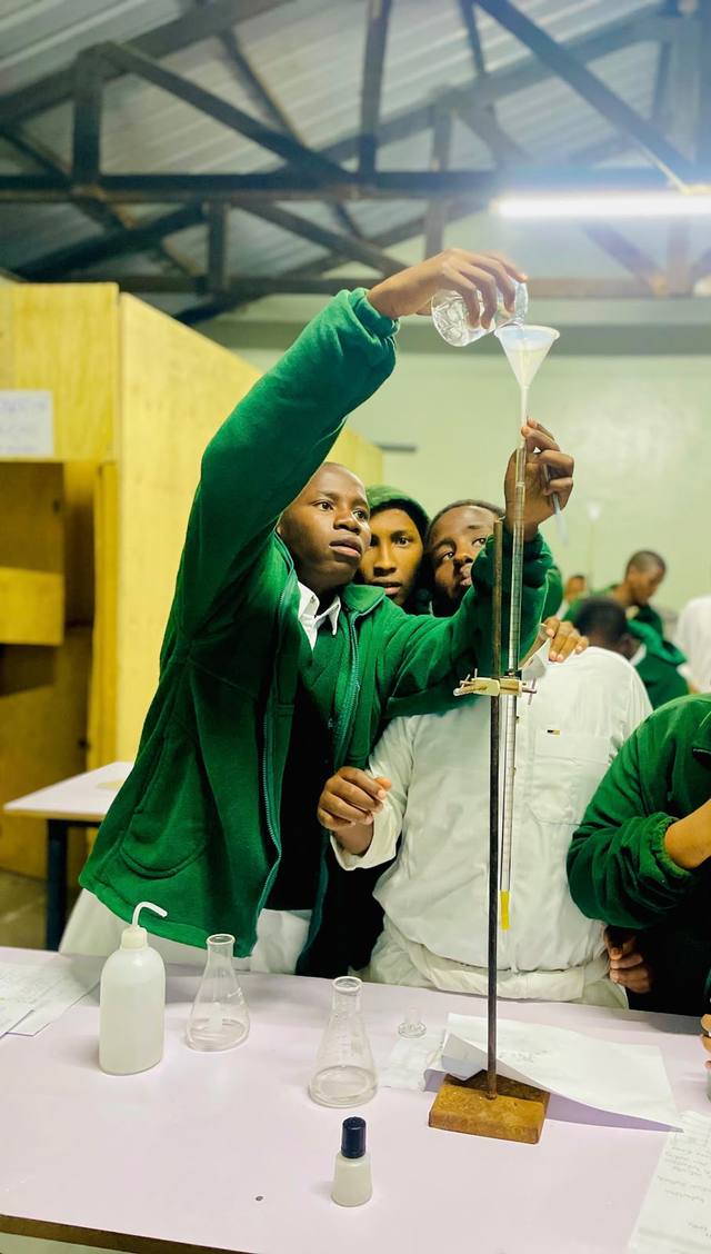 A student carrying out a chemistry experiment in the lab